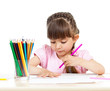 Photo: cute girl drawing with colourful pencils cute girl drawing with colourful pencils