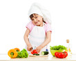 Photo: Chef girl preparing healthy food over white background Chef girl preparing healthy food over white background