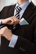 Closeup of torso of confident business man wearing elegant suit