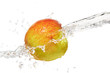 Studio shot of water being poured on a suspended apple against a