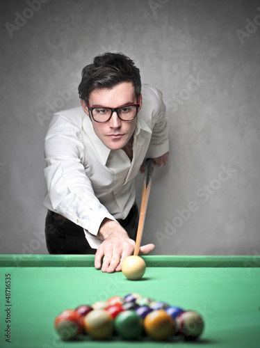 Photo: man playing pool man playing pool