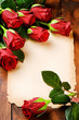 Photo: Frame with red roses and vintage paper Frame with red roses and vintage paper