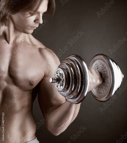 Photo: Exercising with dumbbell Exercising with dumbbell