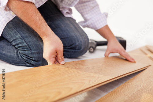 Photo: Laying laminate flooring - closeup Laying laminate flooring - closeup