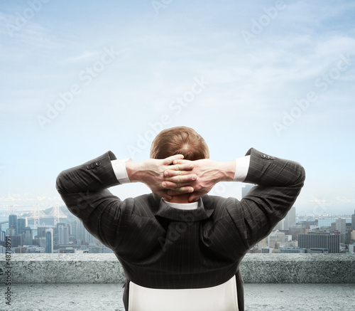 Photo: man seeing to city man seeing to city
