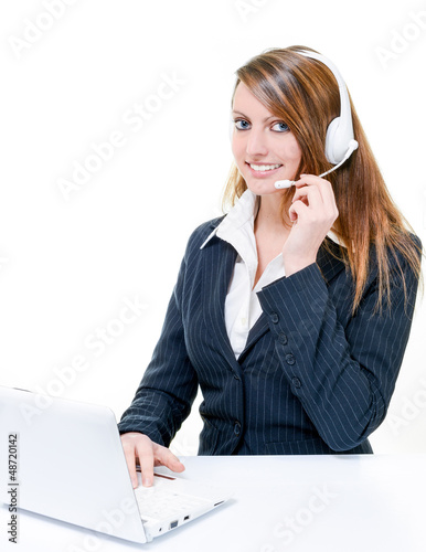 Photo: Smiling attractive woman on line in help desk Smiling attractive woman on line in help desk