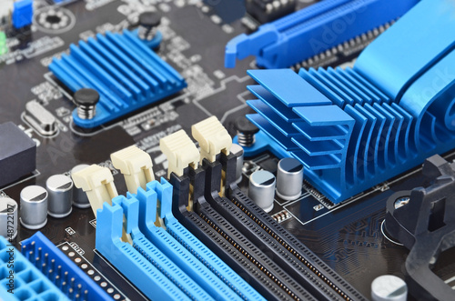 Photo: Printed computer motherboard board RAM connector slot Printed computer motherboard board RAM connector slot