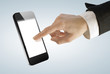 Young businesswoman touching screen on digital smart phone