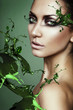 close up portrait of sexy woman in green plant splash