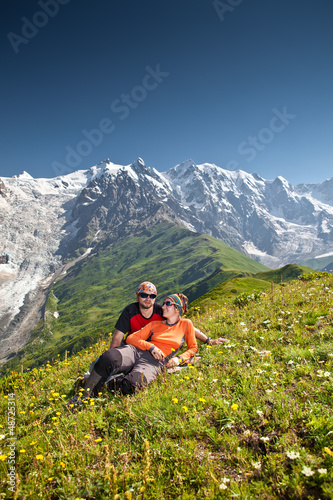Photo: Hiker take a rest during hiking in Caucasus mountains, Georgia Hiker take a rest during hiking in Caucasus mountains, Georgia
