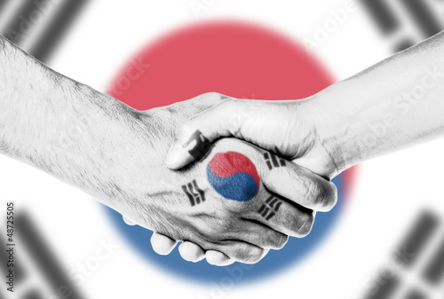 Photo: Man and woman shaking hands Man and woman shaking hands