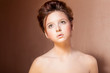 Portrait of Young Teen Girl over Beige Background