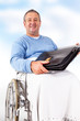 Man in wheelchair with a briefcase