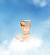 woman practicing yoga lotus pose