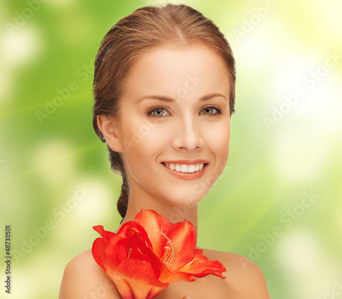 Photo: lovely woman with red lily flower lovely woman with red lily flower