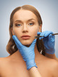 woman face and beautician hands