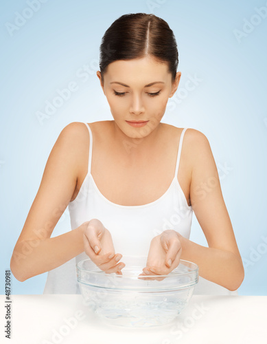 Photo: woman washing her face woman washing her face