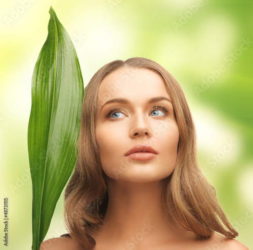 Photo: woman with green leaf woman with green leaf