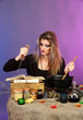 Photo: Halloween witch stirring in poison soup in her cauldron Halloween witch stirring in poison soup in her cauldron