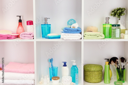 Photo: Bath accessories on shelfs in bathroom Bath accessories on shelfs in bathroom