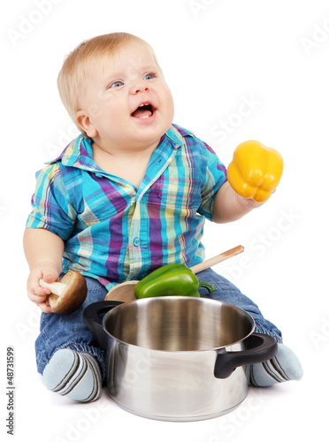 Photo: Little boy with pan and vegetables, isolated on white Little boy with pan and vegetables, isolated on white