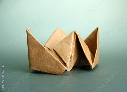 Photo: Origami steamer on grey background Origami steamer on grey background
