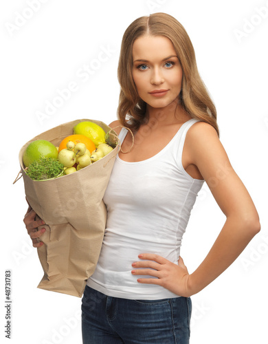Photo: woman with shopping bag full of fruits woman with shopping bag full of fruits