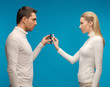 Photo: man and woman with modern gadgets man and woman with modern gadgets