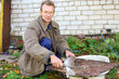 Photo: thin man cut up fish for cooking thin man cut up fish for cooking