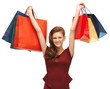 teenage girl in red dress with shopping bags