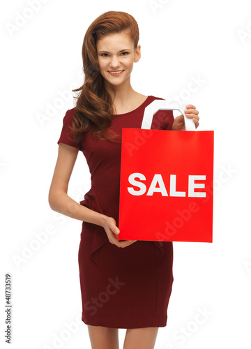 Photo: teenage girl in red dress with sale sign teenage girl in red dress with sale sign