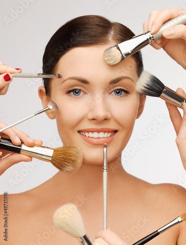 Photo: beautiful woman with brushes beautiful woman with brushes