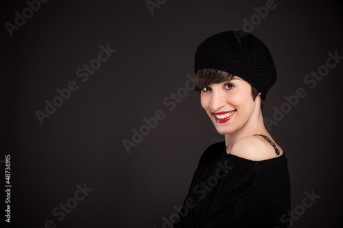 Photo: Smiling girl with french style outfit and copy space Smiling girl with french style outfit and copy space