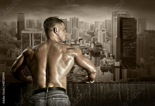 Photo: Man stay on the roof of skyscraper Man stay on the roof of skyscraper
