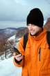 Photo: Backpacker looking at GPS Backpacker looking at GPS