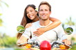 Happy young couple in love on scooter