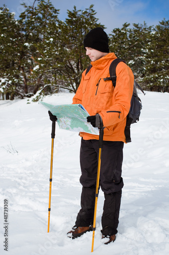 Photo: Hiker looking at map Hiker looking at map