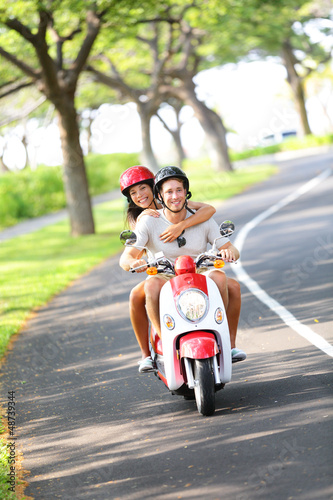 Photo: Scooter - couple driving in summer Scooter - couple driving in summer