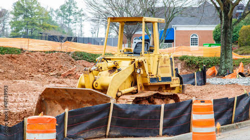 Photo: Yellow Bulldozer on Dirt Site Yellow Bulldozer on Dirt Site