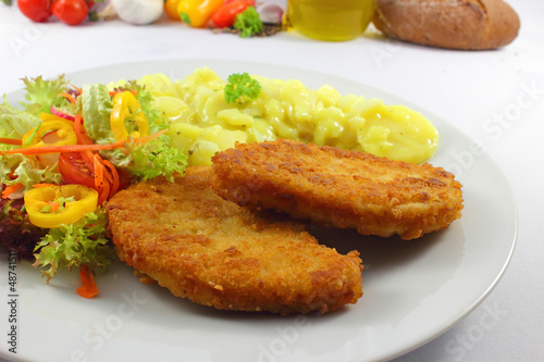 Photo: Pork cutlets with salad - Schweineschnitzel mit Salat Pork cutlets with salad - Schweineschnitzel mit Salat