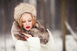 Photo: Beautiful girl in wintertime outdoor Beautiful girl in wintertime outdoor