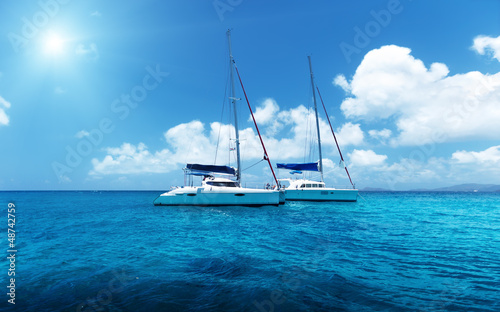 Photo: Yacht Sailing on water of ocean Yacht Sailing on water of ocean