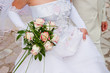 wedding bouquet in the hands of fiancee