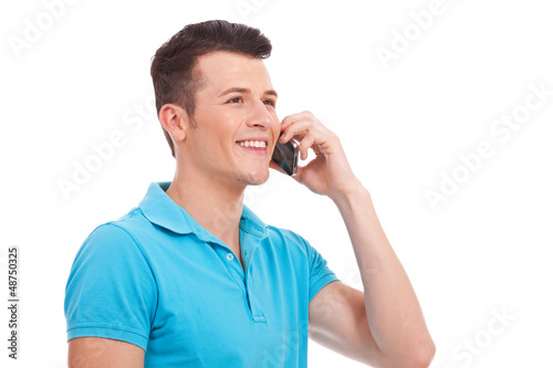 Photo: casual man talking on cell phone casual man talking on cell phone