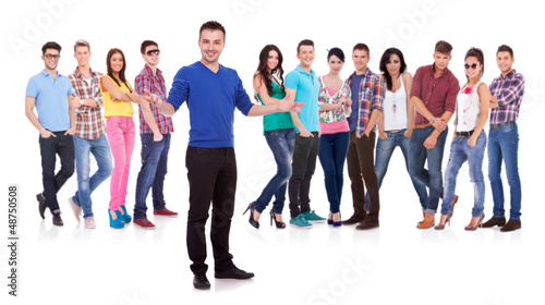 Photo: man welcoming to his casual fashion team man welcoming to his casual fashion team