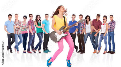 Photo: woman guitarist playing rock and roll woman guitarist playing rock and roll