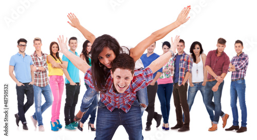 Photo: excited young couple playing in front of team excited young couple playing in front of team