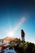 Hiker walking in autumn mountains