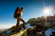 Hiker walking in autumn mountains