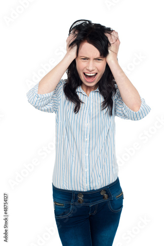 Photo: Frustrated young lady screaming loud Frustrated young lady screaming loud